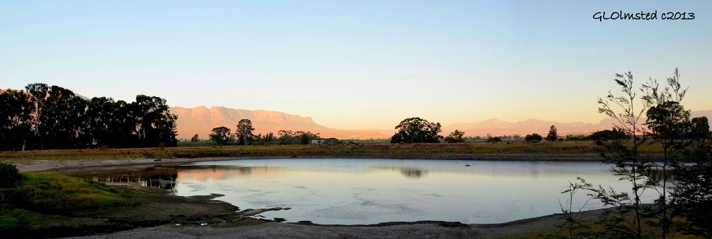 Late light on mountains across dam at Rhodene Farm Cottage Ceres SA