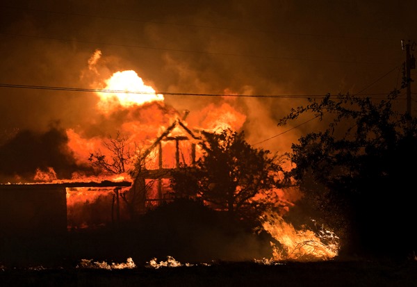 Home burning Yarnell Hill Fire AP photo Tom Story