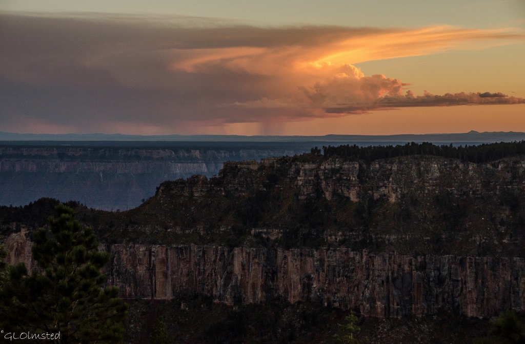 Sunset and rain over South Rim from North Rim Grand Canyon National Park Arizona