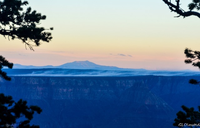 Sunset view South with smoldering smoke on South Rim from Wedding site Cape Royal North Rim Grand Canyon National Park Arizona