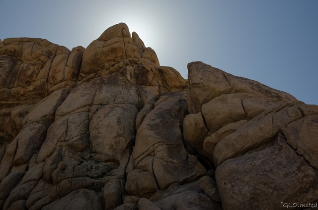 Sun behind boulders Hidden Valley Joshua Tree National Park California