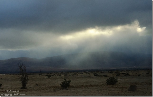 Last light thru storm clouds Vallecito Mountains Anza-Borrego Desert State Park California