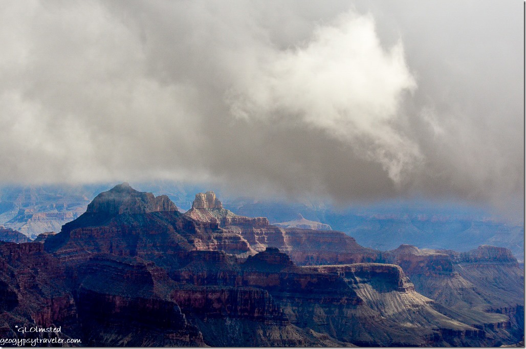 Low clouds over temples from Transept trail overlook North Rim Grand Canyon National Park Arizona
