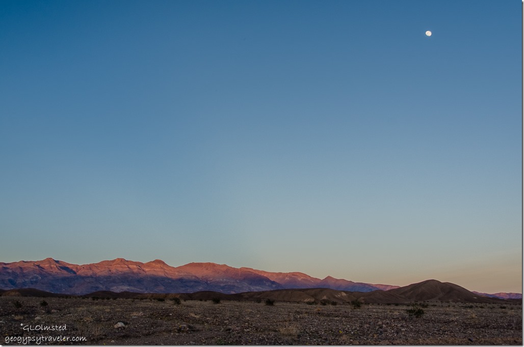 Last light on mountains & moon Death Valley National Park California