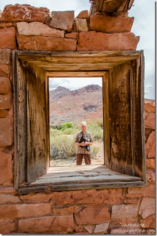 Diane through window of 1910 Stone building Lees Ferry Glen Canyon National Recreation Area Arizona