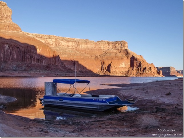 Morning light & boat from camp Dungeon Canyon Lake Powell Glen Canyon National Recreation Area Utah