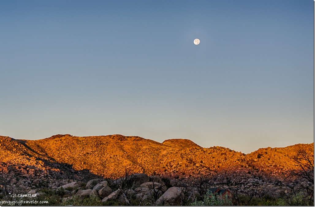 setting full moon morning light Weaver Mountains Yarnell Arizona