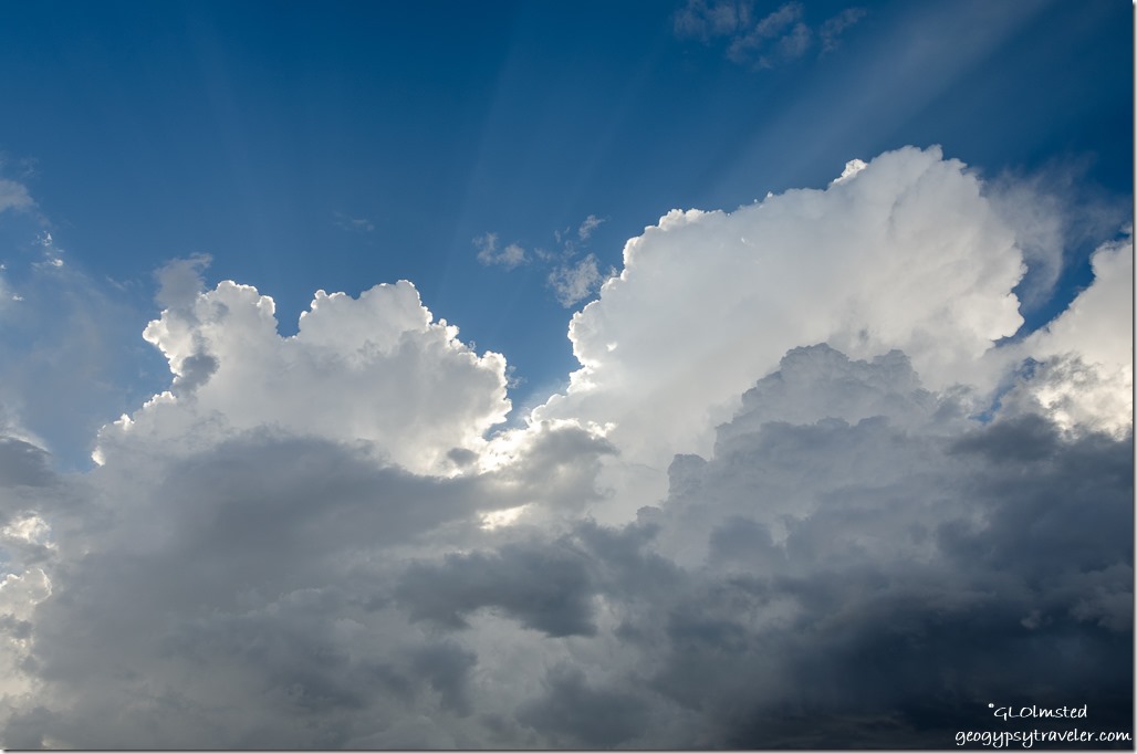 sun lit cumulonimbus clouds crepuscular rays Yarnell Arizona