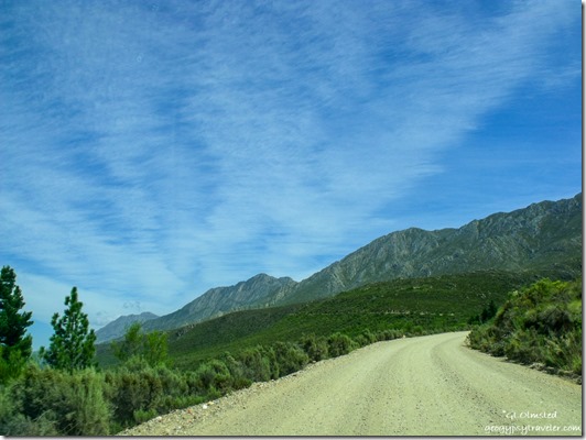 trees mountains clouds road Swartberg Pass South Africa