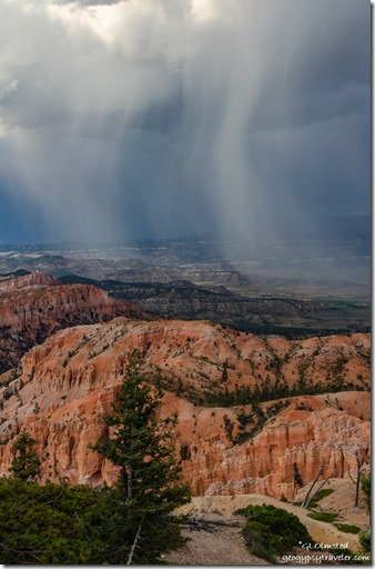 trees hoodoos valley sunset storm clouds from Bryce Point Bryce Canyon National Park Utah