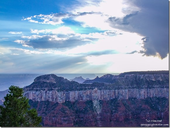 Sun thru clouds over Widforss Point North Rim Grand Canyon National Park Arizona