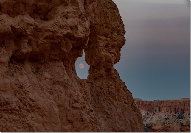 almost full moon thru hoodoo window Navajo Loop Trail Bryce Canyon National Park Utah