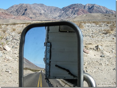 Black Mts view N reflected Badwater Rd Death Valley National Park California
