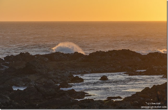 Sunset crashing waves on rocky coast Indian Ocean Tsitsikamma NP South Africa