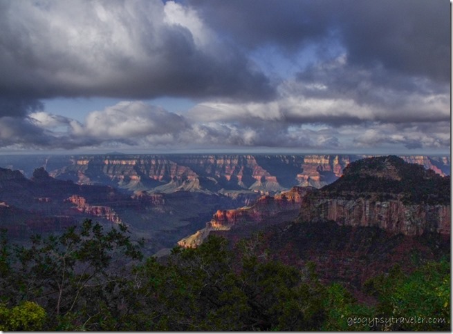 a1969lewfbr Dark sky over morning sunlit canyon from Lodge North Rim Grand Canyon National Park Arizona