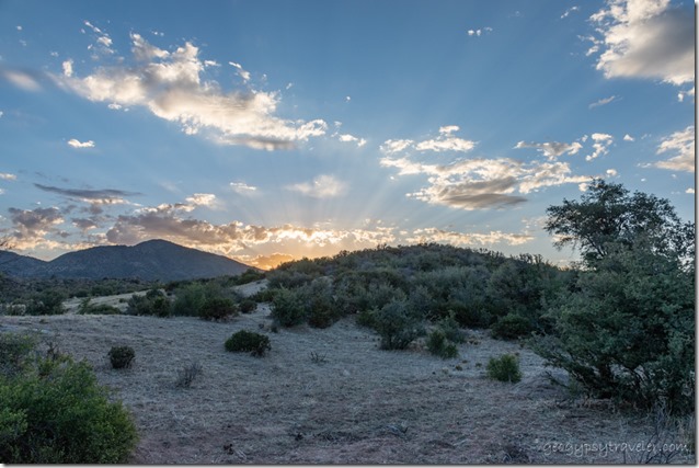 grass bush sunset clouds crepuscular rays Skull Valley AZ