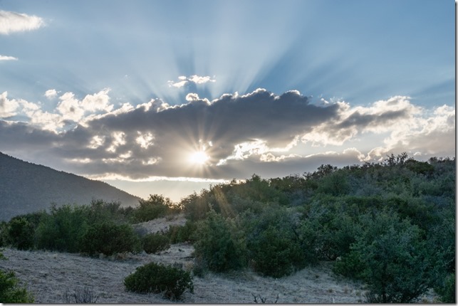 grass brush clouds sunburst crepuscular rays Skull Valley AZ