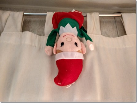 elf hanging upside down