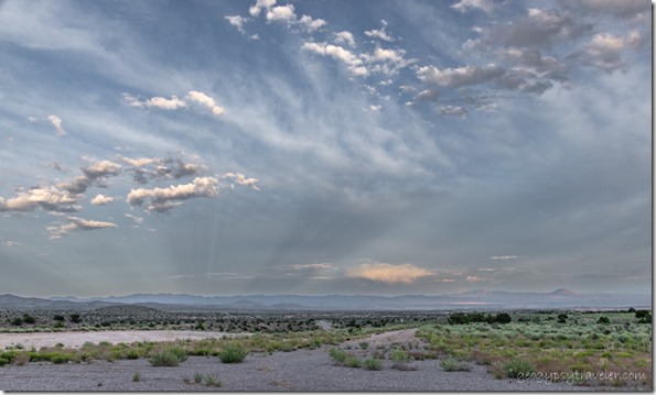 view SE rds mts anticrepuscular rays reverse sunset clouds SR320 Pioche NV